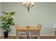 A close-up view of a dining room with a wooden table and seating for four at 2247 Rolling Hill Ct, Columbus, IN 47201