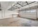 Spacious garage with overhead storage racks and ample room for vehicles and projects at 2247 Rolling Hill Ct, Columbus, IN 47201