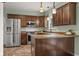 Well-equipped kitchen with stainless steel appliances and dark wood cabinetry at 2247 Rolling Hill Ct, Columbus, IN 47201