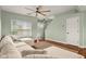 Inviting living room featuring a large sectional sofa, natural light, and view of the front door at 2247 Rolling Hill Ct, Columbus, IN 47201