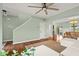 Bright open-concept living room with modern furnishings, dining area, and patio access at 2247 Rolling Hill Ct, Columbus, IN 47201
