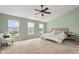 A brightly lit main bedroom with carpet, large windows, and neutral colors at 2247 Rolling Hill Ct, Columbus, IN 47201