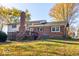 Exterior of home with deck, brick chimney, and spacious backyard at 2457 N Centerline Rd, Franklin, IN 46131