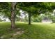 Expansive backyard featuring mature trees, green grass, and plenty of room for outdoor activities at 2457 N Centerline Rd, Franklin, IN 46131