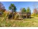 Wooden deck and stairs surrounded by lush greenery and ornamental grasses at 2457 N Centerline Rd, Franklin, IN 46131