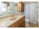 Traditional bathroom with a light brown vanity, granite countertop, and a shower with a patterned curtain at 2457 N Centerline Rd, Franklin, IN 46131