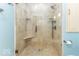 Close up of walk in shower with seat and updated shower head at 2457 N Centerline Rd, Franklin, IN 46131
