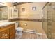 Well-lit bathroom with a vanity, framed mirror, toilet, and glass-enclosed shower at 2457 N Centerline Rd, Franklin, IN 46131