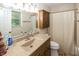 Bathroom with a single vanity, wood cabinets, and shower/tub combination with tile flooring at 2457 N Centerline Rd, Franklin, IN 46131