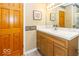 Bright bathroom featuring a wood vanity, white countertop, and decorative accents at 2457 N Centerline Rd, Franklin, IN 46131