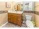 Cozy half bath features a vanity with storage, commode, and natural light at 2457 N Centerline Rd, Franklin, IN 46131