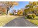 Charming home featuring a long driveway and lush landscaping with mature trees at 2457 N Centerline Rd, Franklin, IN 46131