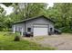 View of the detached oversized garage with an abundance of storage space and extra parking area at 2457 N Centerline Rd, Franklin, IN 46131