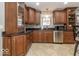 Well-appointed kitchen features granite countertops, stainless steel appliances, and custom cabinetry at 2457 N Centerline Rd, Franklin, IN 46131