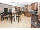 Eat in kitchen with custom cabinets, stainless steel appliances, tile backsplash, and island with barstool seating at 2457 N Centerline Rd, Franklin, IN 46131