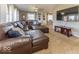 Spacious living room features a large sectional sofa, wall-mounted TV, and ample natural light at 2457 N Centerline Rd, Franklin, IN 46131
