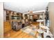 Open-concept living space with hardwood floors, an electric fireplace, and access to the kitchen at 2457 N Centerline Rd, Franklin, IN 46131