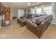 Cozy living room offers a large leather sectional, plush carpet, and an inviting atmosphere at 2457 N Centerline Rd, Franklin, IN 46131
