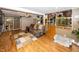 Open-concept living area with hardwood floors, a ceiling fan, and convenient access to the kitchen at 2457 N Centerline Rd, Franklin, IN 46131