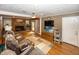 Inviting living room features a brick fireplace, ceiling fan, and access to the front entrance at 2457 N Centerline Rd, Franklin, IN 46131