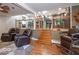 Spacious living room features a unique barber chair and overlooks the kitchen at 2457 N Centerline Rd, Franklin, IN 46131
