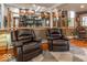 Comfortable living room features two recliners and a unique barber style chair at 2457 N Centerline Rd, Franklin, IN 46131