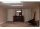 Spacious bedroom with a double door closet, a modern dresser, and minimal furnishings at 2620 13Th St, Columbus, IN 47201