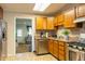 Efficient kitchen featuring wood cabinets, stainless steel appliances, and easy access to the living area at 2620 13Th St, Columbus, IN 47201