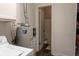 Practical laundry area featuring a water heater, and connections to additional storage at 2620 13Th St, Columbus, IN 47201
