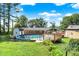 Backyard showcasing an above-ground pool, and large wooden deck with adjacent storage buildings at 2907 Jay Dee Ln, Greenwood, IN 46143