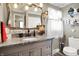 Well decorated bathroom featuring grey cabinets, granite countertops, and a lovely vanity mirror at 2907 Jay Dee Ln, Greenwood, IN 46143