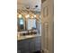 Stylishly updated bathroom with granite countertop, and decorative mirror at 2907 Jay Dee Ln, Greenwood, IN 46143