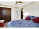 Comfortable bedroom with blue bedding, ceiling fan, and closet space at 2907 Jay Dee Ln, Greenwood, IN 46143