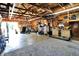 Spacious garage with custom woodworking and lighting fixtures, suitable for the serious hobbyist at 2907 Jay Dee Ln, Greenwood, IN 46143