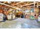 Large garage space with ample storage, custom wall art, and work areas to keep you busy at 2907 Jay Dee Ln, Greenwood, IN 46143