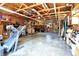 Large garage with open rafters provides space for projects, exercise, and parking at 2907 Jay Dee Ln, Greenwood, IN 46143
