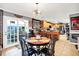Bright kitchen and dining area featuring stainless steel appliances, wood cabinets, and an open layout at 2907 Jay Dee Ln, Greenwood, IN 46143