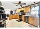 Updated kitchen with stainless steel appliances, wooden cabinets, and tile floors at 2907 Jay Dee Ln, Greenwood, IN 46143