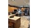 Spacious kitchen with natural wood cabinets and tile floors at 2907 Jay Dee Ln, Greenwood, IN 46143