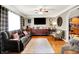 Open-concept living room showcases hardwood floors, cozy seating, and stylish decor at 2907 Jay Dee Ln, Greenwood, IN 46143
