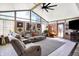 Bright sunroom with a vaulted ceiling, large windows, comfortable seating, and access to the outdoors at 2907 Jay Dee Ln, Greenwood, IN 46143