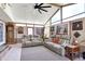 Bright sunroom with large windows, a vaulted ceiling, and comfortable seating, perfect for relaxation at 2907 Jay Dee Ln, Greenwood, IN 46143