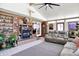 Comfortable sunroom features a fireplace, built-in shelving, and access to the outdoors at 2907 Jay Dee Ln, Greenwood, IN 46143