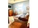 Bright bedroom with a dresser, TV, and a comfortable bed offering a relaxing and inviting space at 317 W State Road 44, Franklin, IN 46131