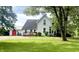 Charming two-story home with a front porch and a spacious, well-manicured lawn, offering a welcoming curb appeal at 317 W State Road 44, Franklin, IN 46131