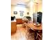 Well-lit kitchen with a center island, stainless steel appliances, and hardwood floors, perfect for cooking and dining at 317 W State Road 44, Franklin, IN 46131