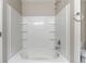 Bright bathroom featuring a tub with white tile surround and chrome fixtures, perfect for relaxation at 3351 Summer Breeze Cir, Indianapolis, IN 46239