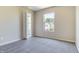 Sunlit bedroom with neutral walls, plush gray carpet, and a bright window, offering comfort and style at 3351 Summer Breeze Cir, Indianapolis, IN 46239