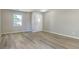 Bright entryway features wood-look flooring, fresh paint, and a window view of the front yard at 3351 Summer Breeze Cir, Indianapolis, IN 46239