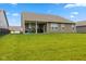 The property has a spacious backyard with a covered patio, ideal for outdoor enjoyment at 3599 Chalmers Dr, Bargersville, IN 46106